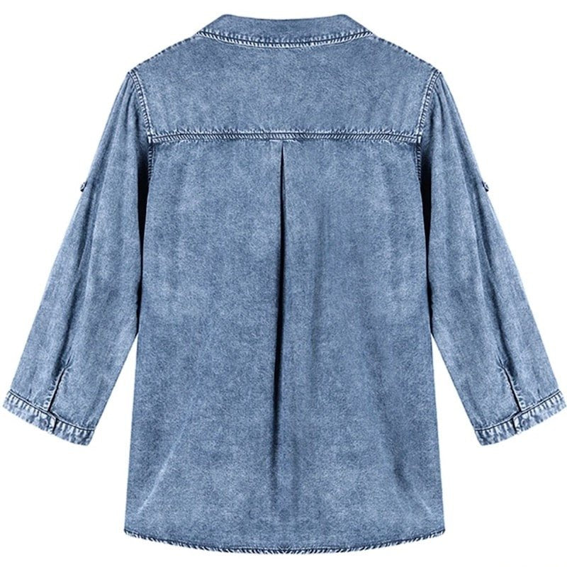 Back view of a blue denim long-sleeved tunic shirt.