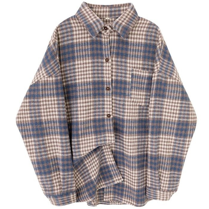 A tan, blue, and white plaid shirt with a front pocket and brown buttons.
