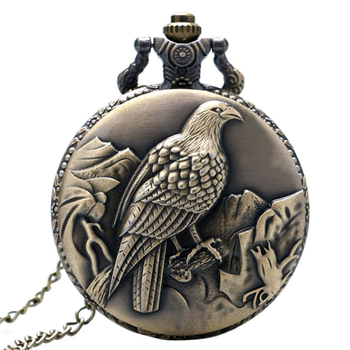 Close-up of a vintage-style bronze pocket watch featuring an eagle design on the cover.