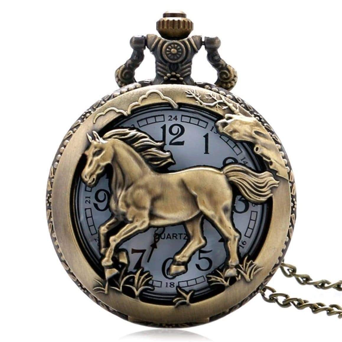 Close-up of a bronze-colored pocket watch with a horse design on the cover.