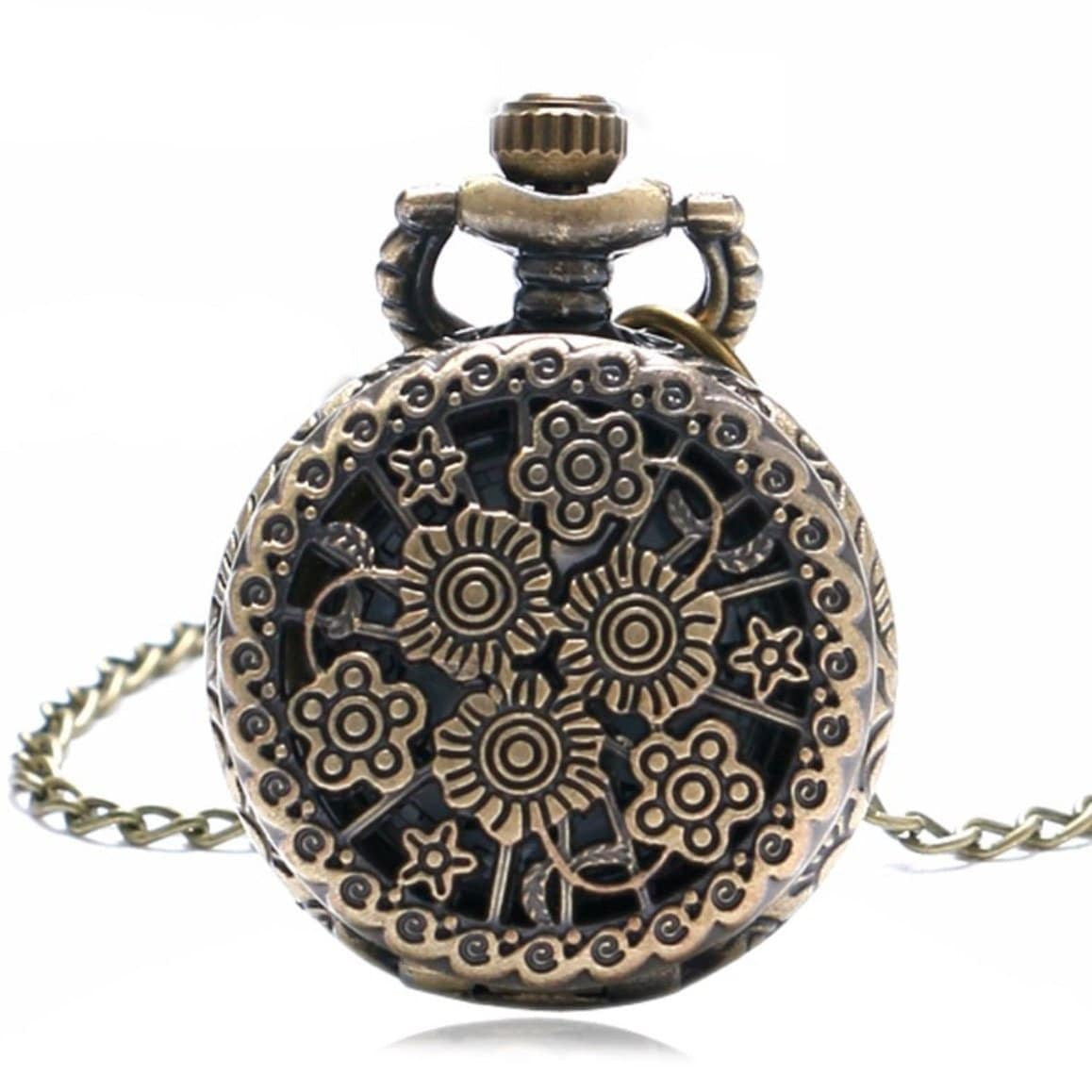 Antique gold pocket watch with floral and star design.
