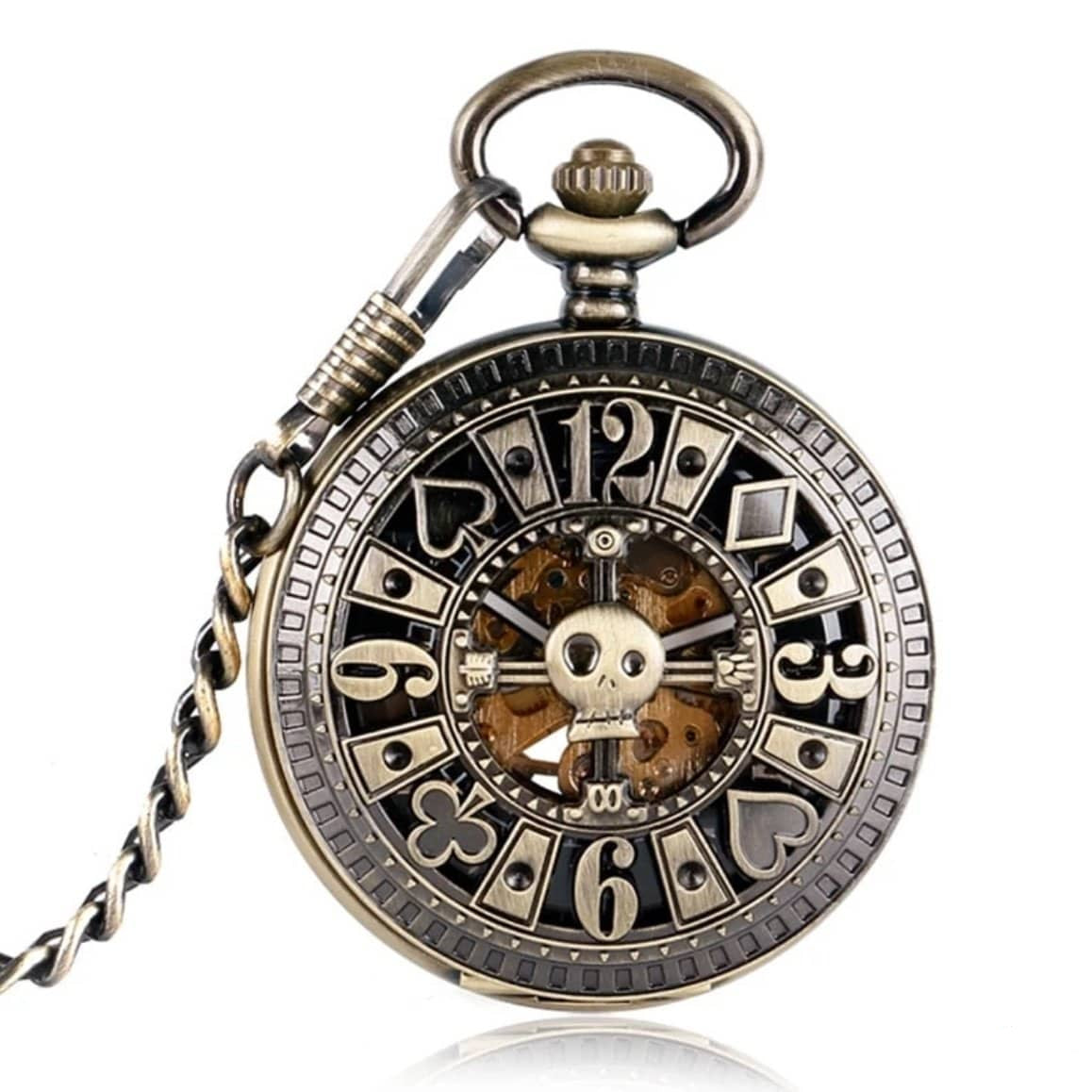 Antique-style pocket watch with skull and playing card suit details.

