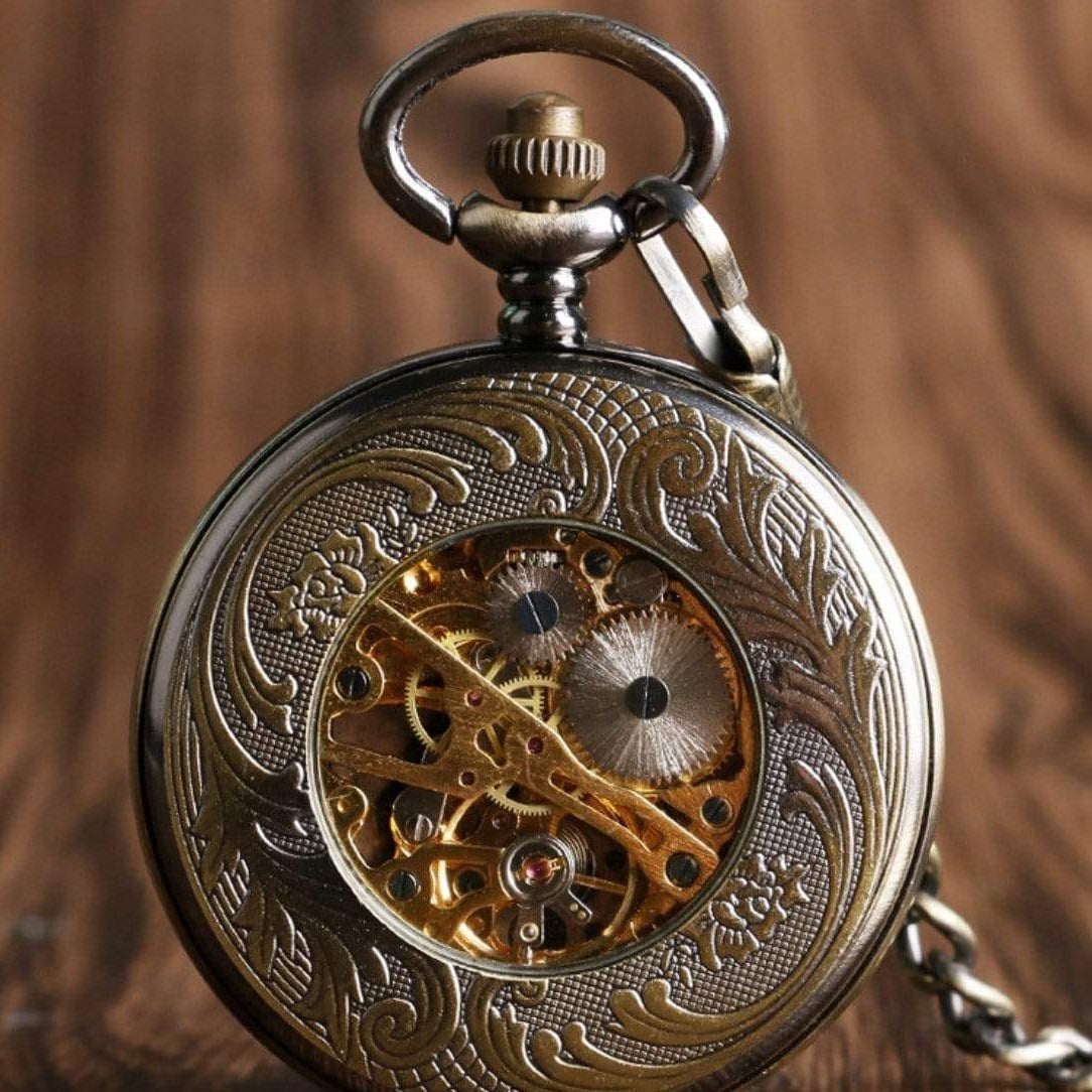 Ornate, gold-toned, open-face pocket watch.