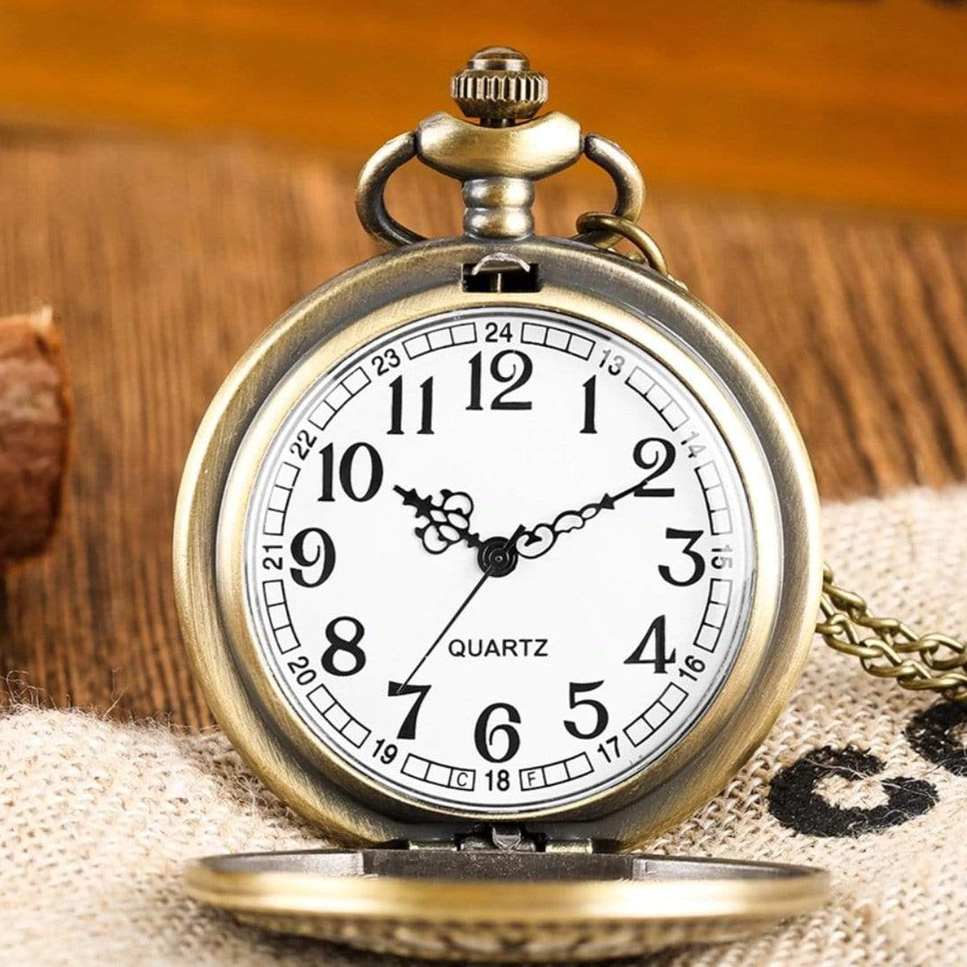 Close-up of bronze quartz pocket watch on burlap.