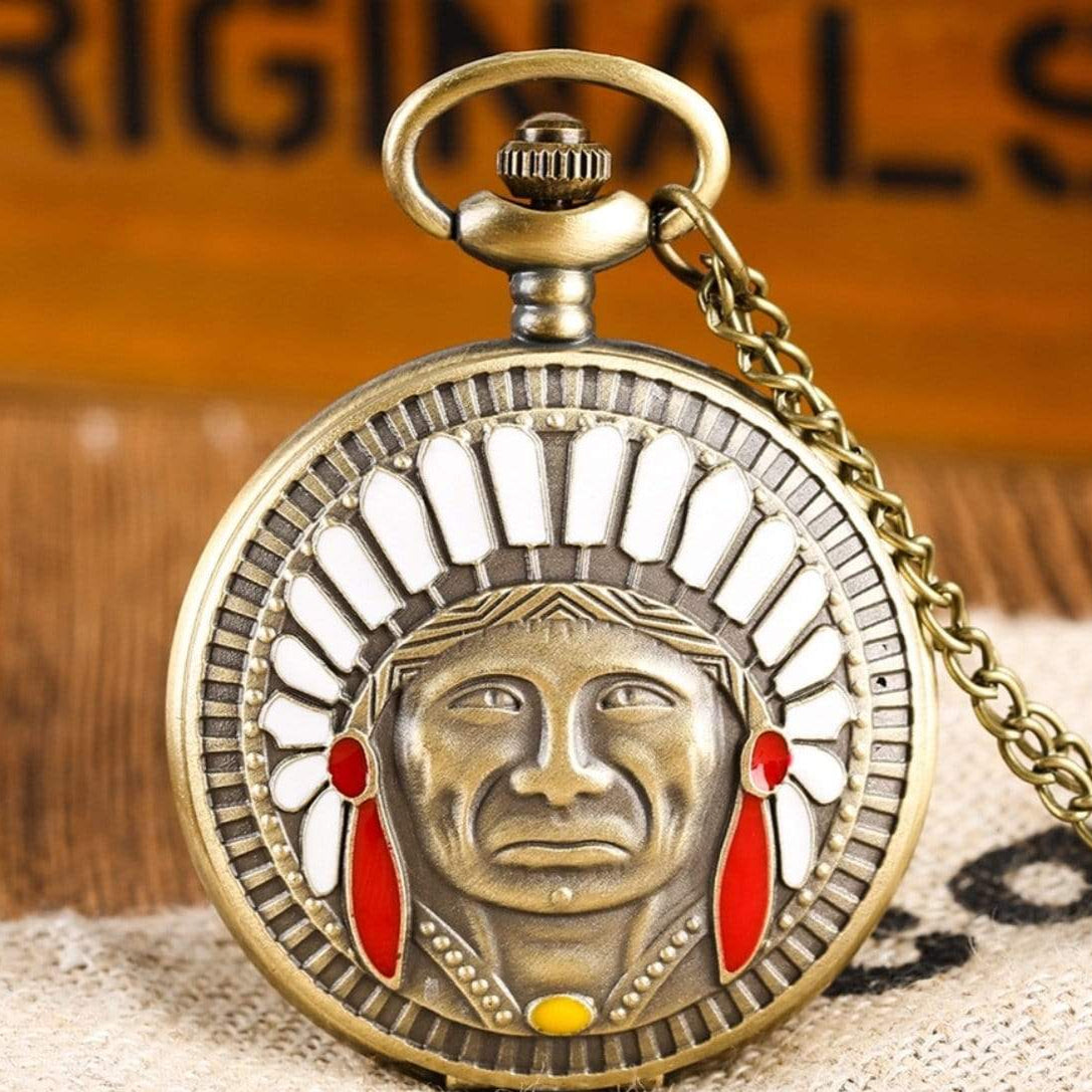 Antique bronze pocket watch with an indigenous face and headdress.