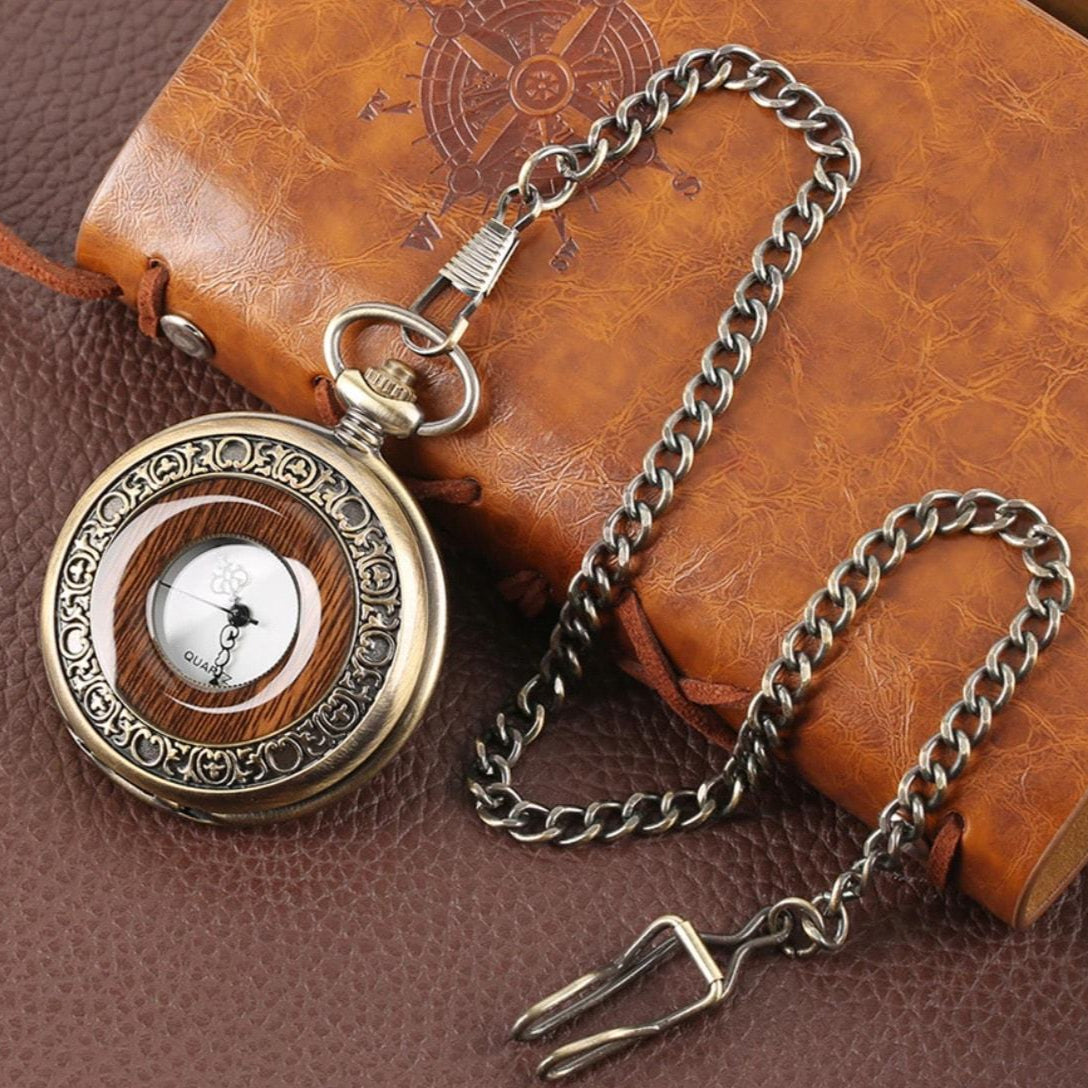 Vintage pocket watch with chain on leather.