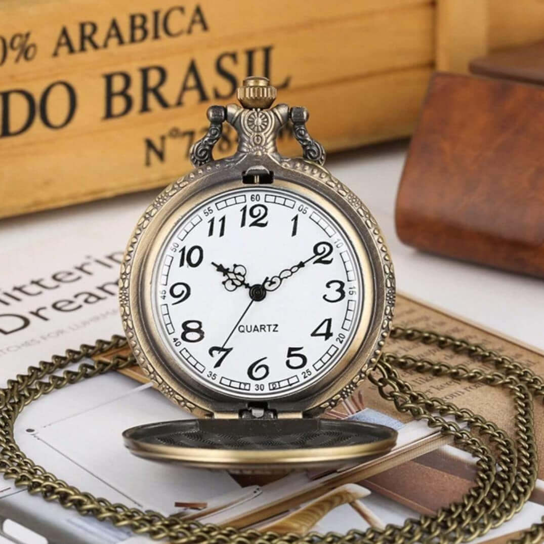 Antique gold pocket watch with chain.
