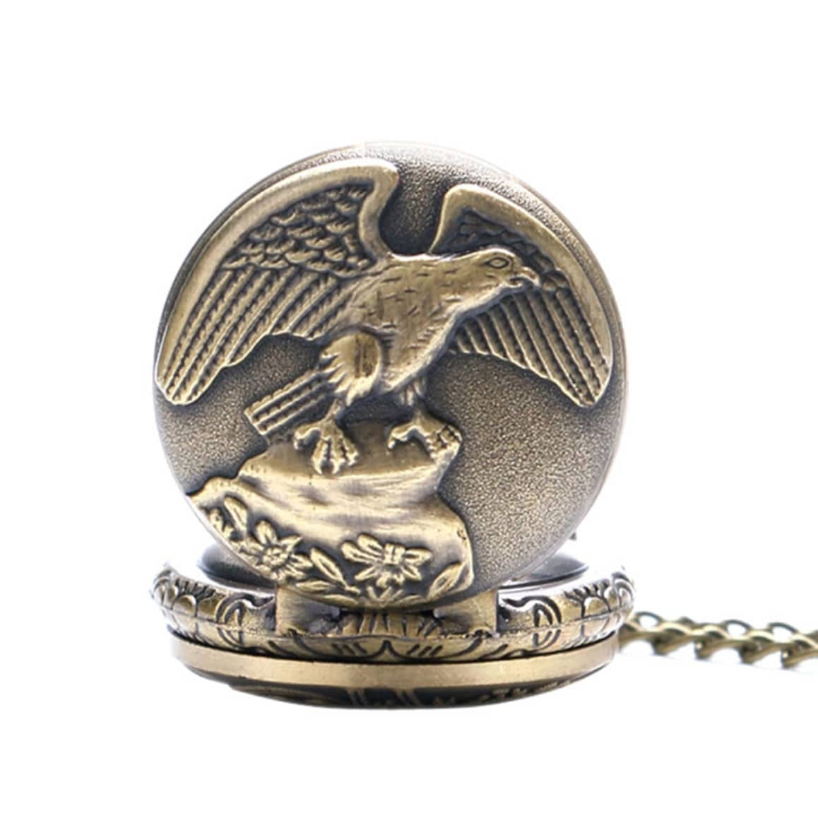 Close-up of an antique gold pocket watch with an eagle design.