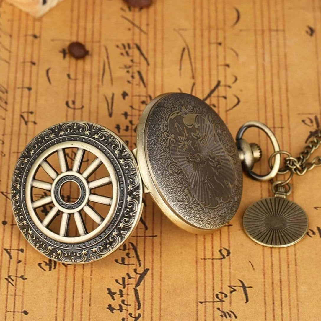 Antique-bronze pocket watch with wagon-wheel cover.