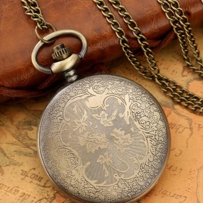 Antique bronze pocket watch with chain.