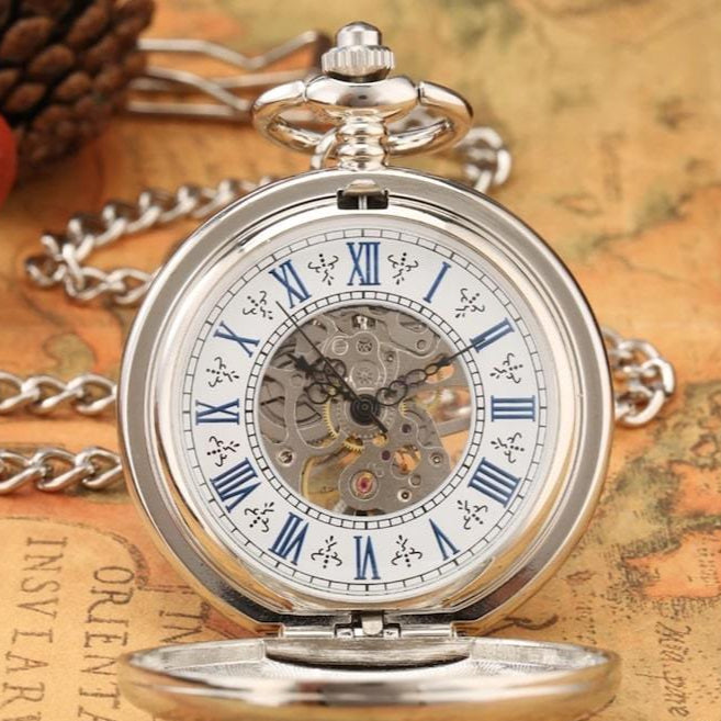 Silver pocket watch with blue Roman numerals on a world map background.
