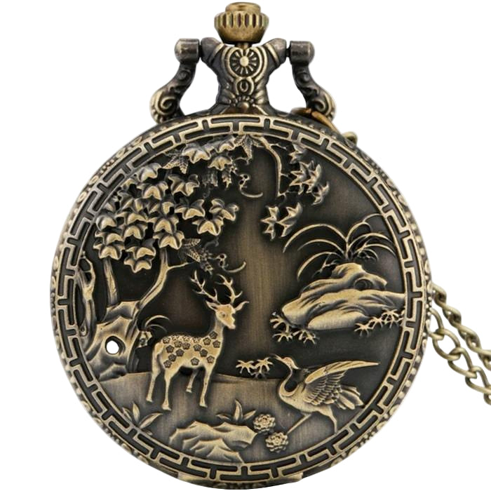 Close-up of an antique-style bronze pocket watch with a nature scene featuring a deer and a crane.
