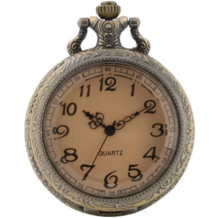 Close-up of an antique-style bronze pocket watch with Roman numerals.