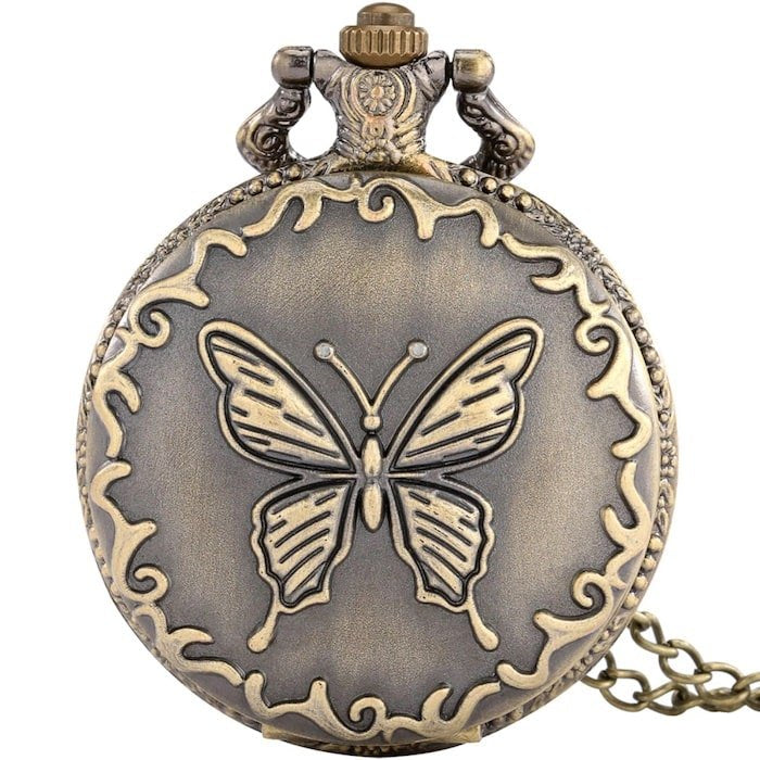 Antique bronze pocket watch with butterfly design. 
