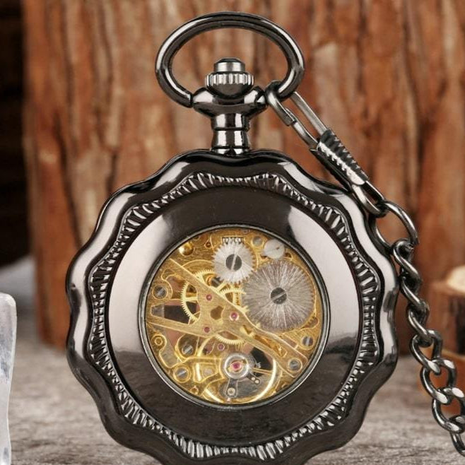 Black pocket watch with visible gears. 
