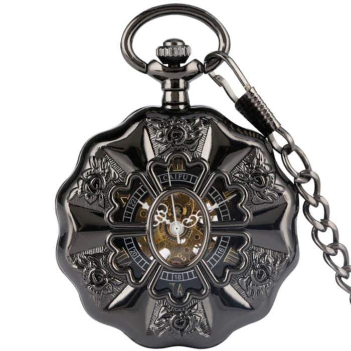 Close-up of a dark gray, ornate pocket watch with a chain.
