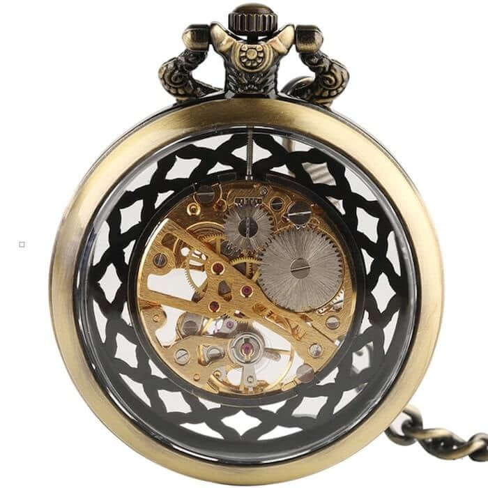 Vintage brass pocket watch with visible gears and intricate open-work design.
