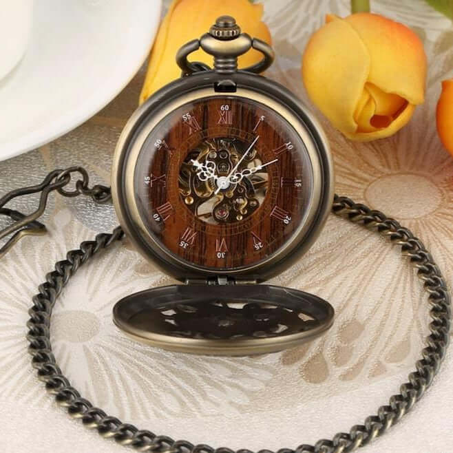 Bronze skeleton pocket watch with chain. 
