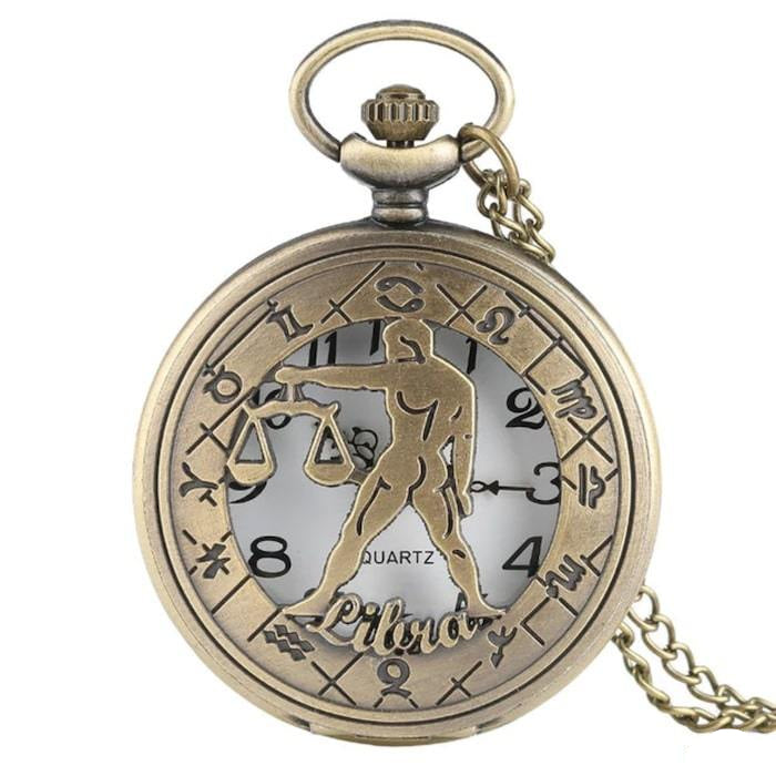 Antique gold pocket watch with Libra design.