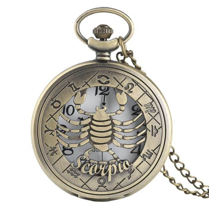 Bronze pocket watch with Scorpio zodiac symbol.