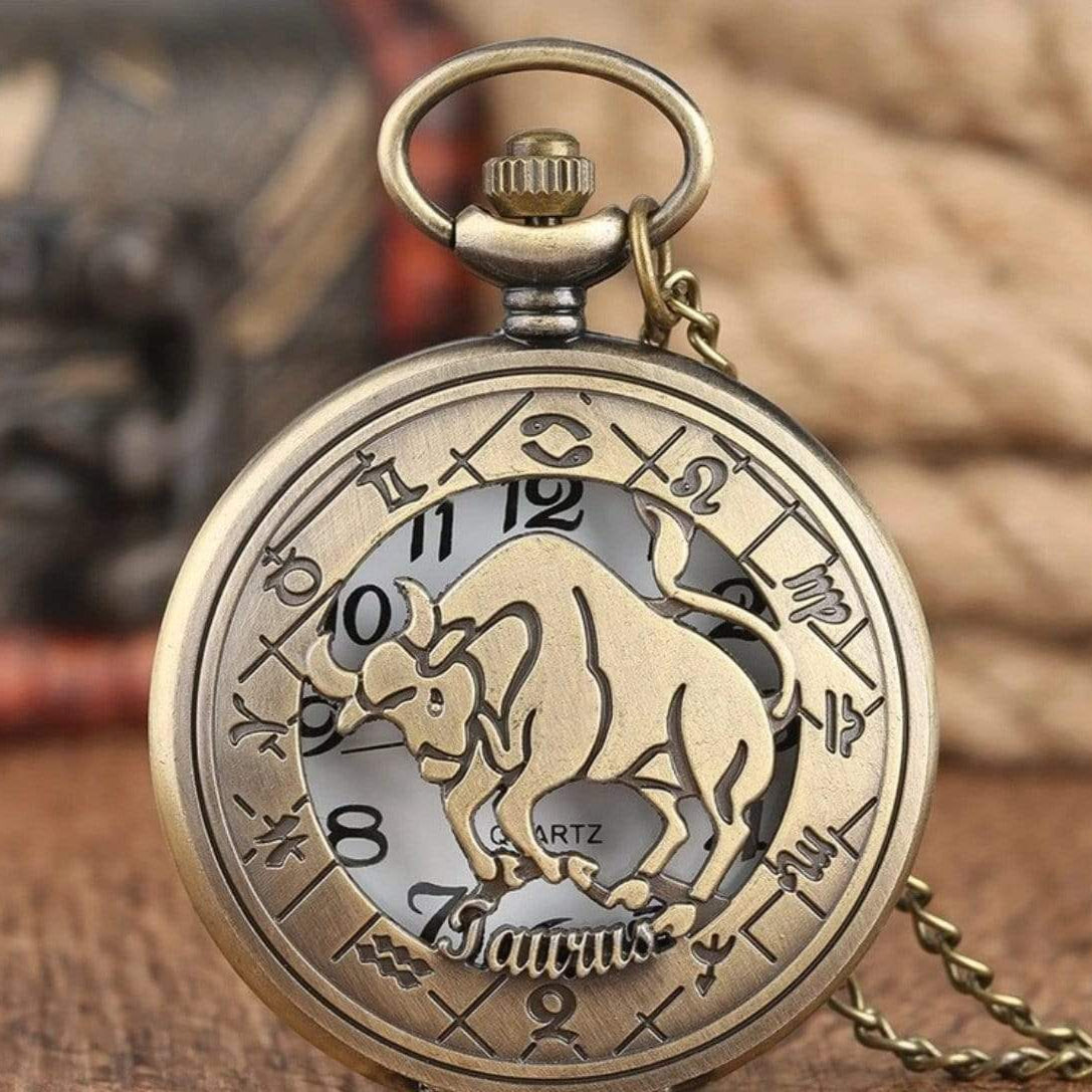 Bronze-colored pocket watch with a Taurus zodiac design.