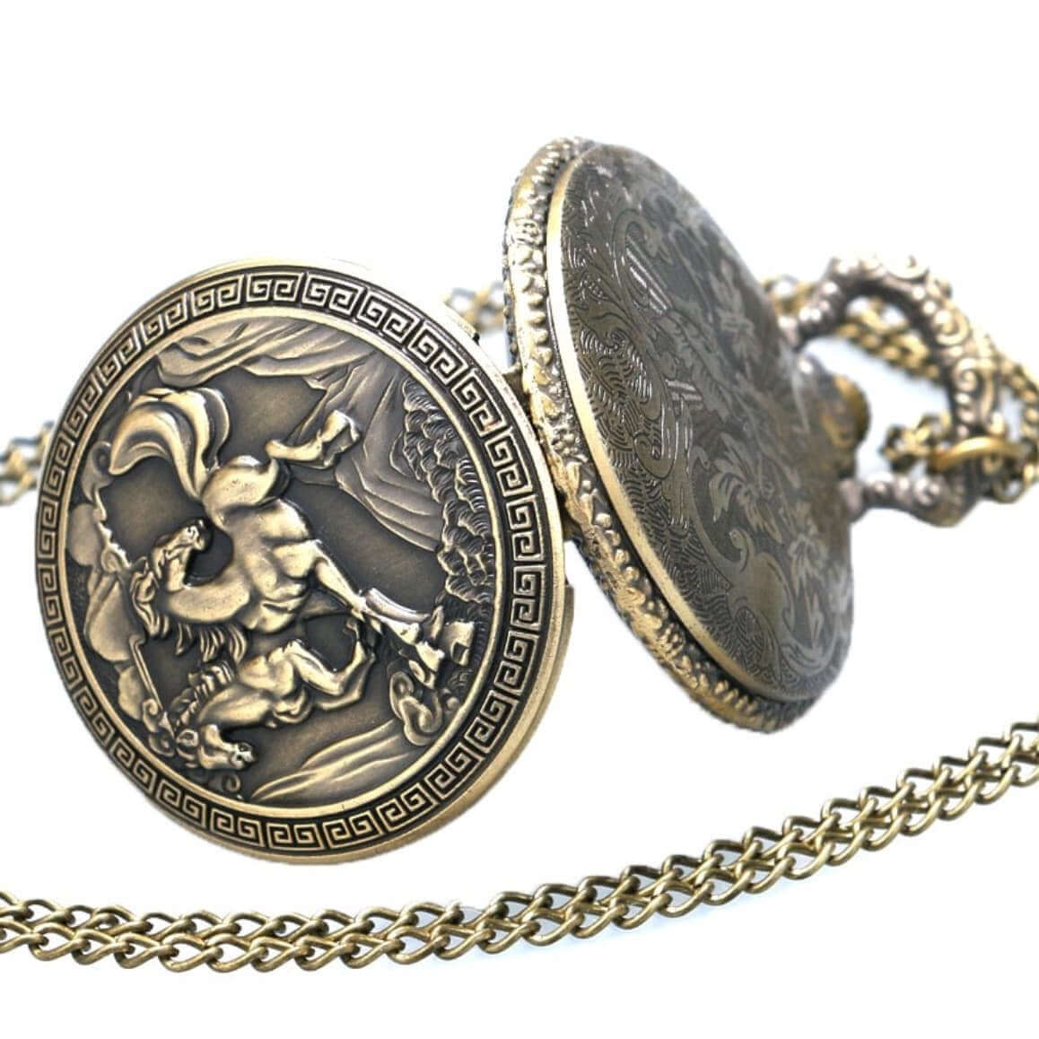 Close-up of a bronze pocket watch with a chain, featuring an embossed design of a mythological scene.
