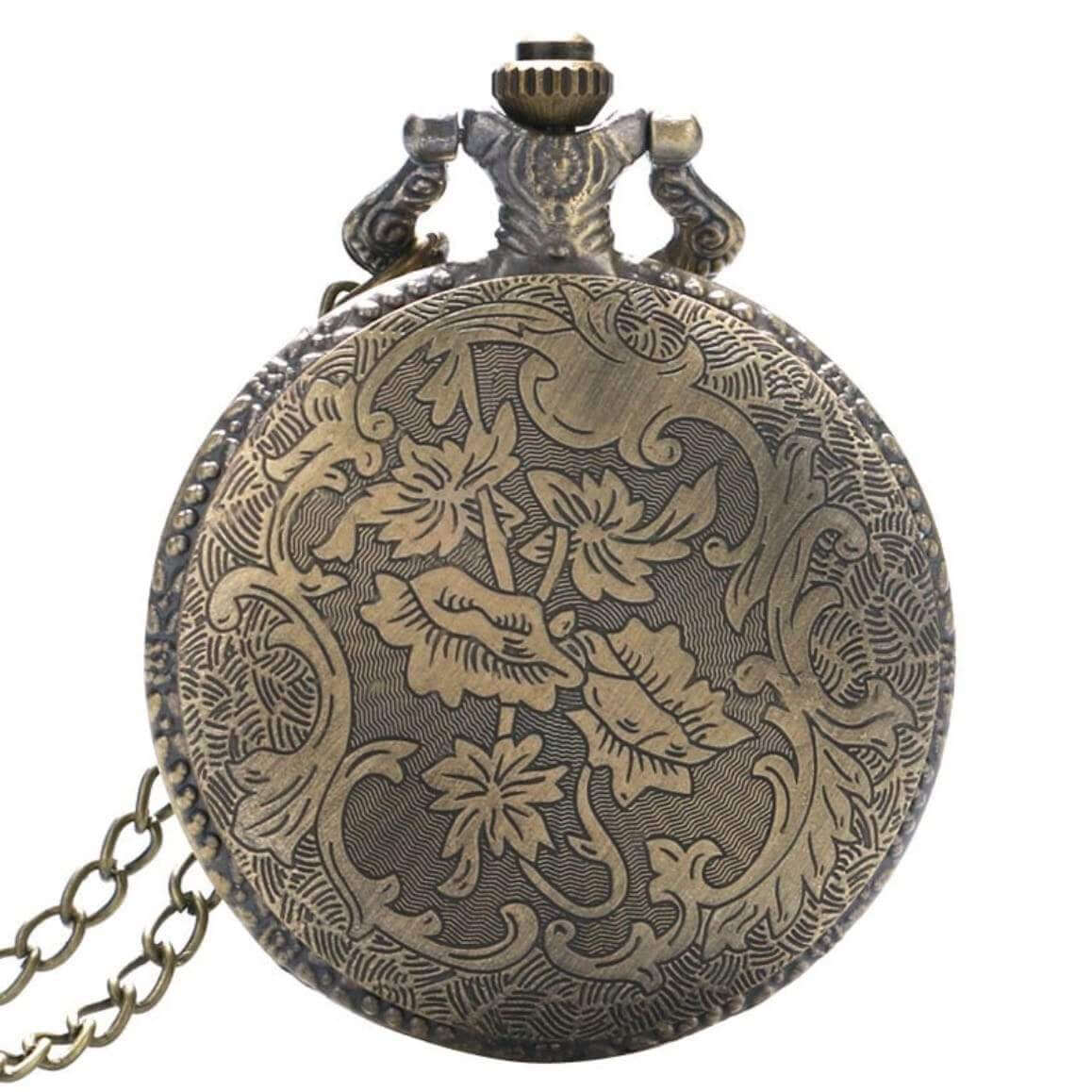 Antique bronze pocket watch with floral engraving and chain. 
