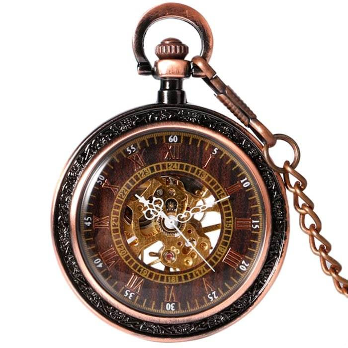 A close-up shot of a vintage-style pocket watch with a copper-colored chain, intricate gears visible within the watch face.
