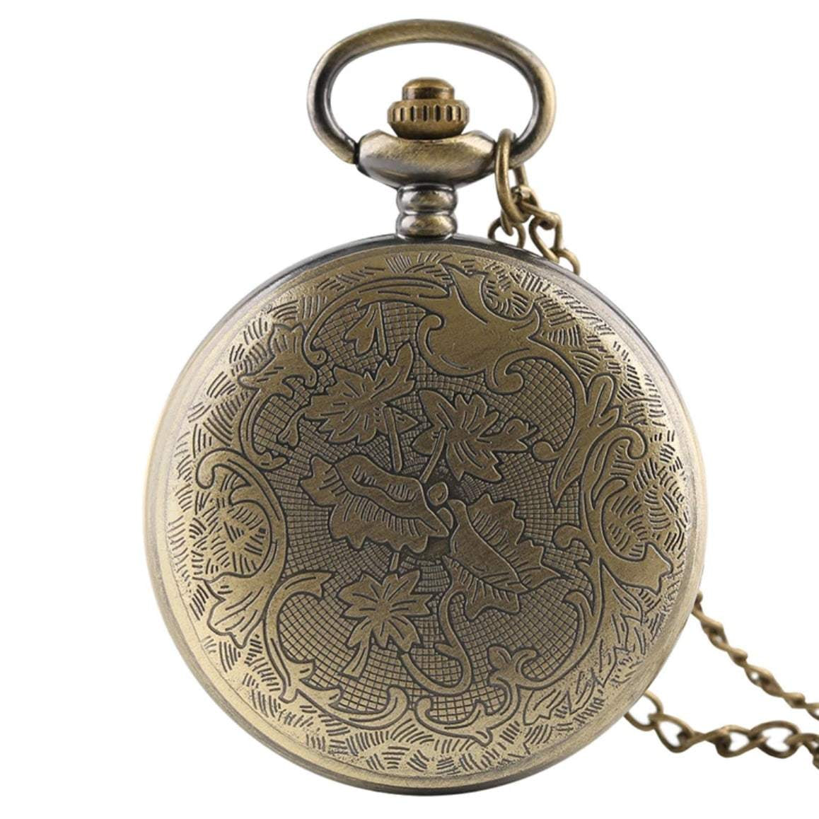 Antique brass pocket watch with floral engraving and chain.
