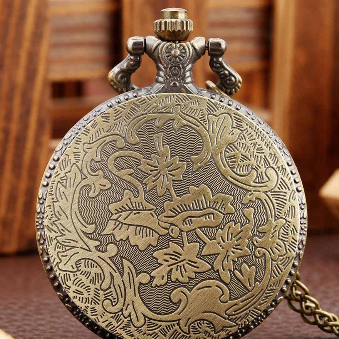 Embossed bronze pocket watch.
