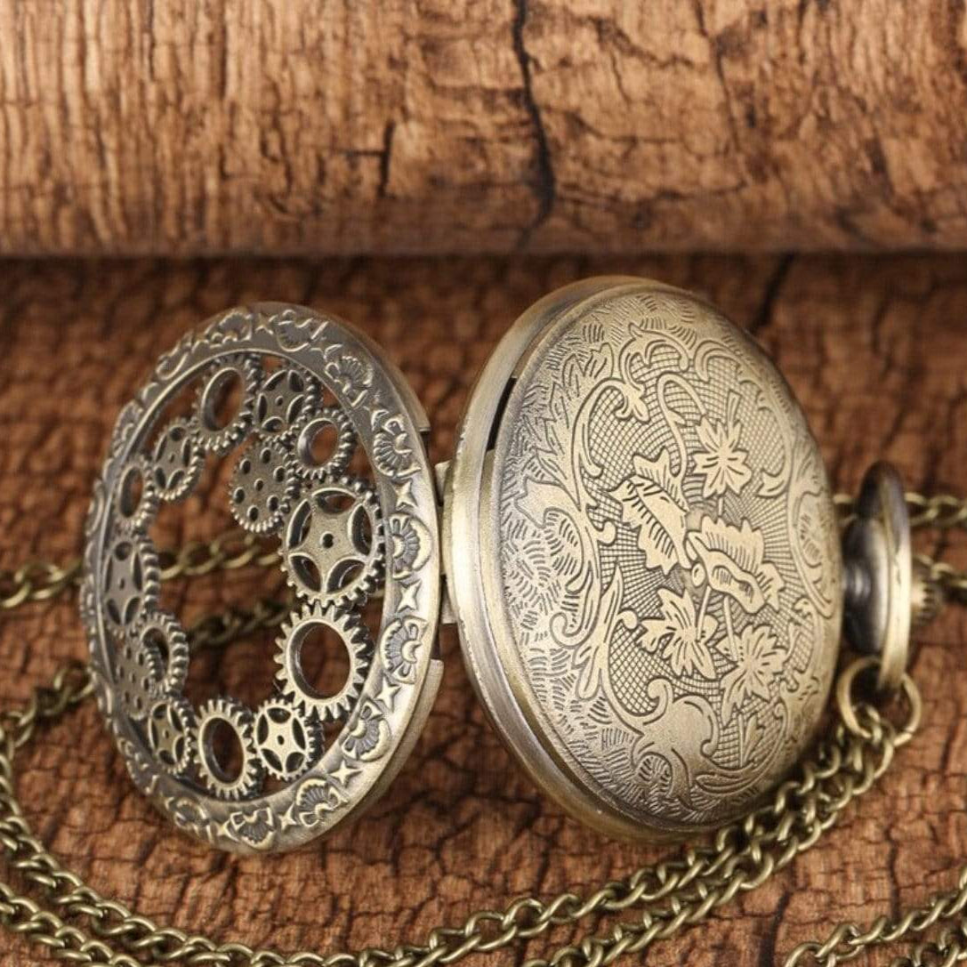 An open pocket watch with a chain.