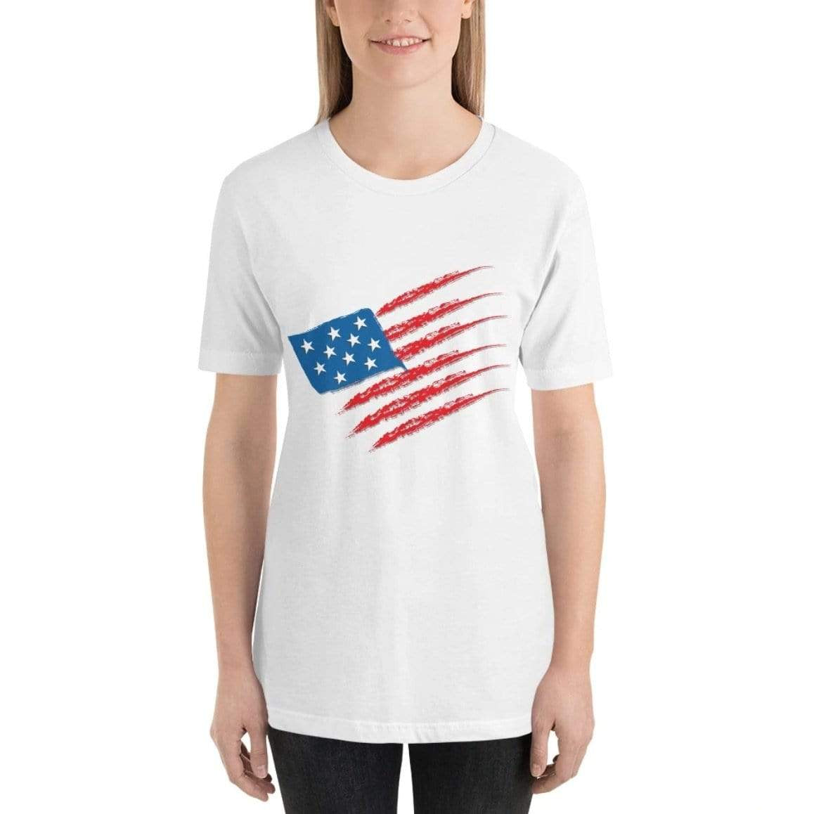 Woman in a white t-shirt with a faded American flag graphic and black jeans.