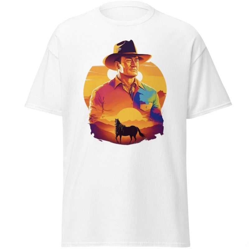 White t-shirt with a graphic of a cowboy and horse against a sunset backdrop.