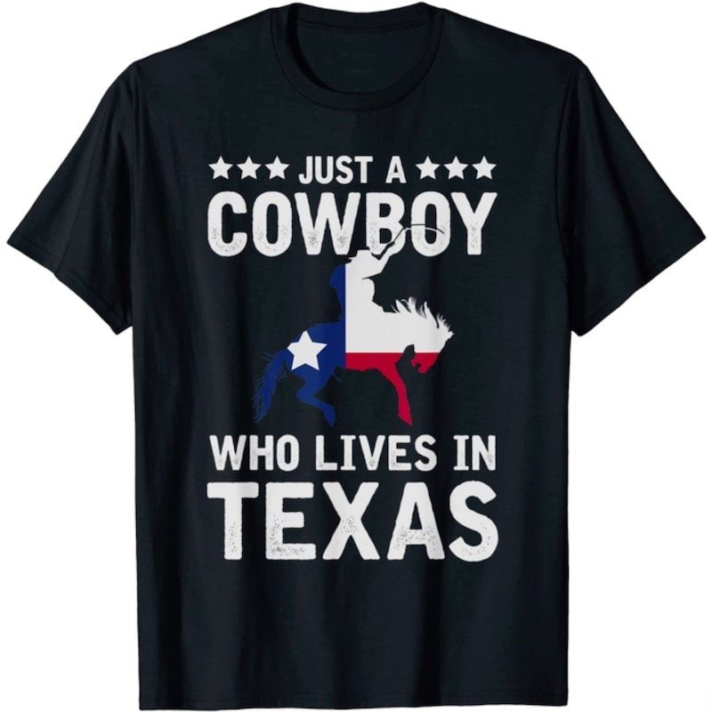 Black t-shirt with white text and cowboy graphic in Texas flag colors.