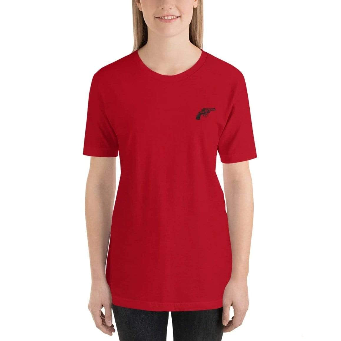 A woman wearing a red t-shirt with a gun graphic.
