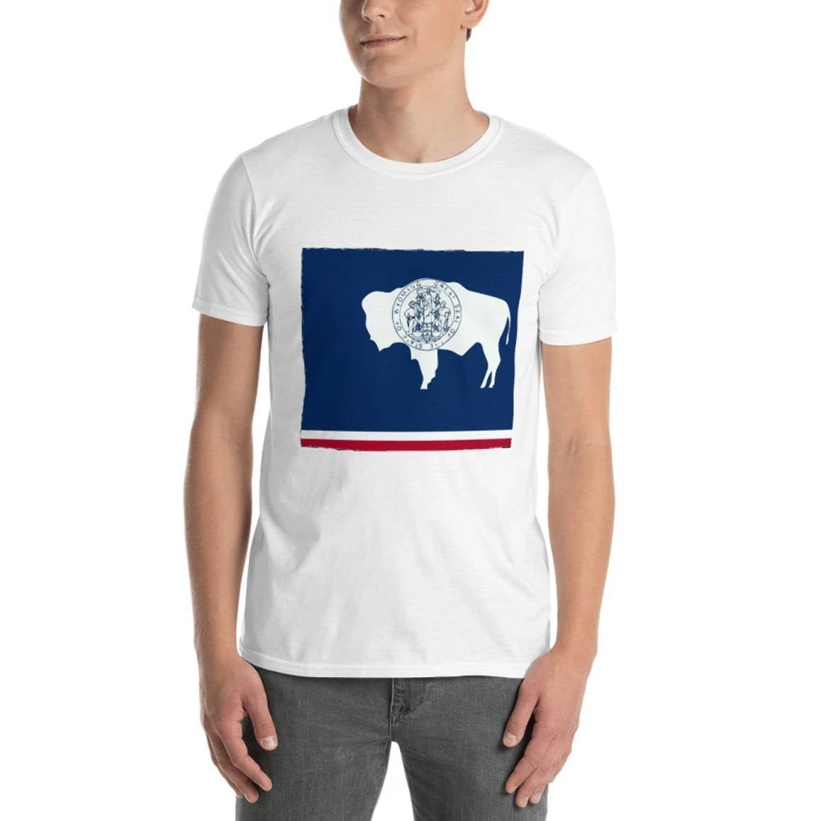 A man wearing a white t-shirt with a Wyoming flag design on the front.