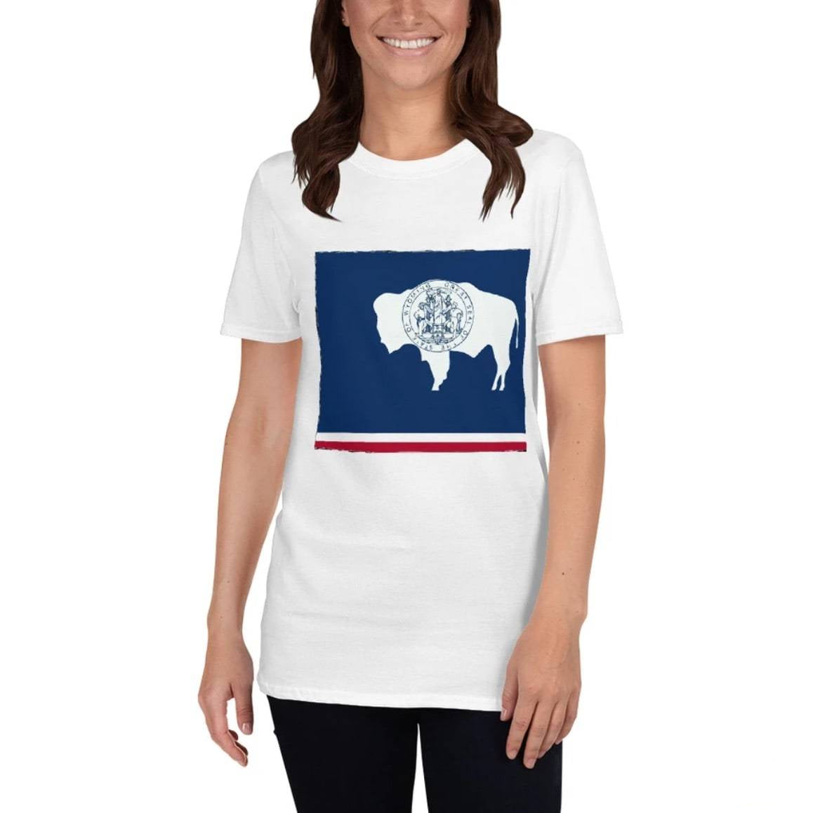 A woman wearing a white t-shirt with the Wyoming state flag design.