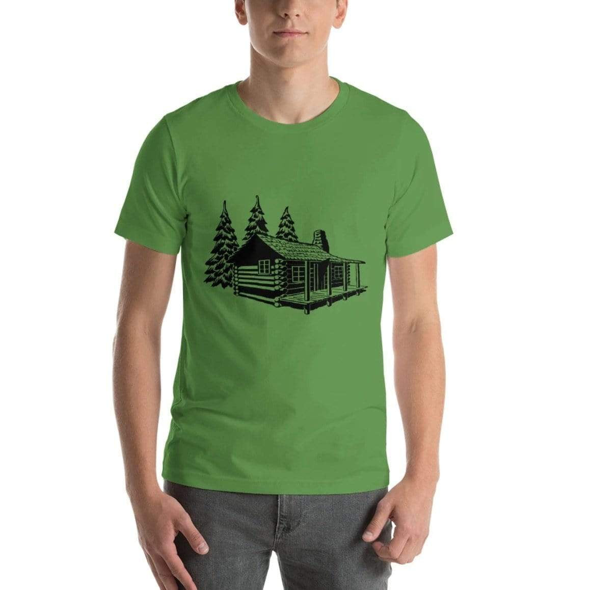 A man wearing a green t-shirt with a log cabin and tree graphic.